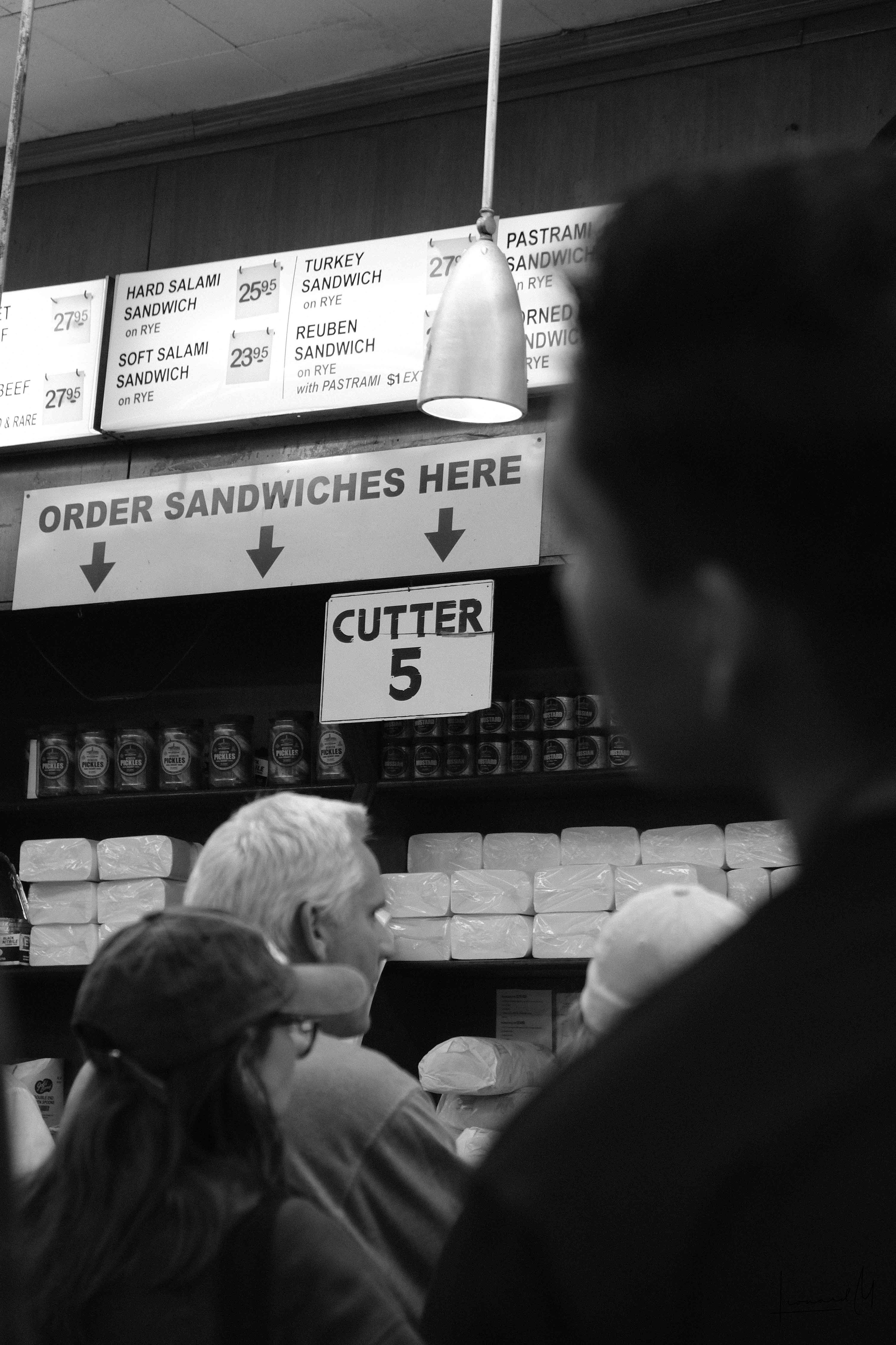 A worker's focused moment in the urban landscape.