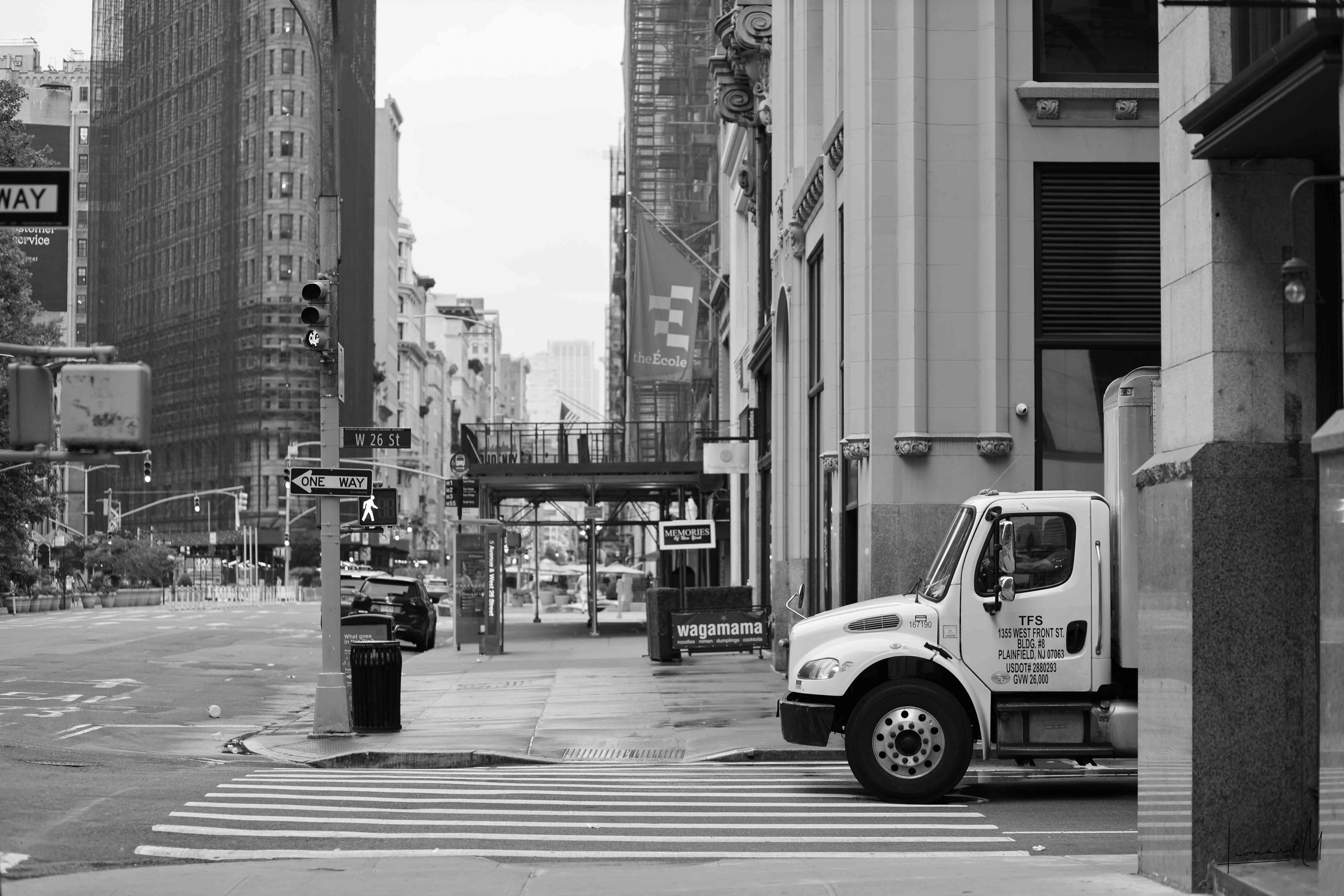 A vehicle departing from the urban landscape.